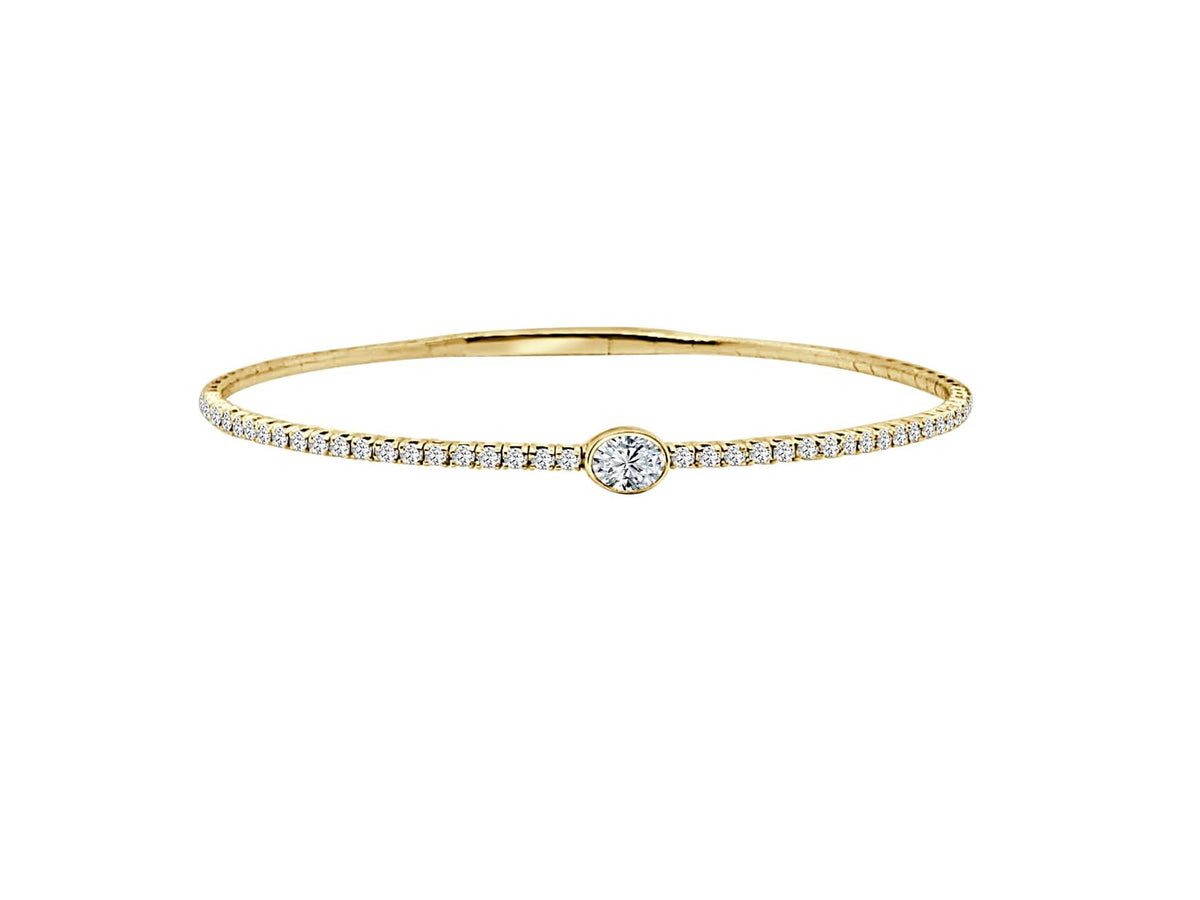 14Kt Yellow Gold Flexible Bangle with .20Ct Natural Oval Diamond and .44cttw Natural Accent Diamonds