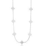 White gold station necklace featuring bezel-set diamond accents on a delicate chain.