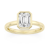 Yellow gold engagement ring featuring an emerald-cut diamond with hidden halo and pavé diamond accents.