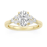 Yellow gold engagement ring featuring an oval-cut diamond with pavé halo and diamond accent band.