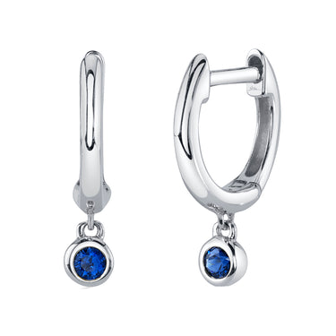 Shy Creation 14kt White Gold Huggie Hoop Earrings With .08cttw Blue Sapphire Bezel Set Dangle