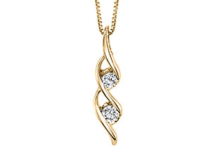 Yellow gold pendant necklace with abstract ribbon-inspired diamond design.