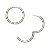 White gold abstract open-circle earrings with modern sculptural design.