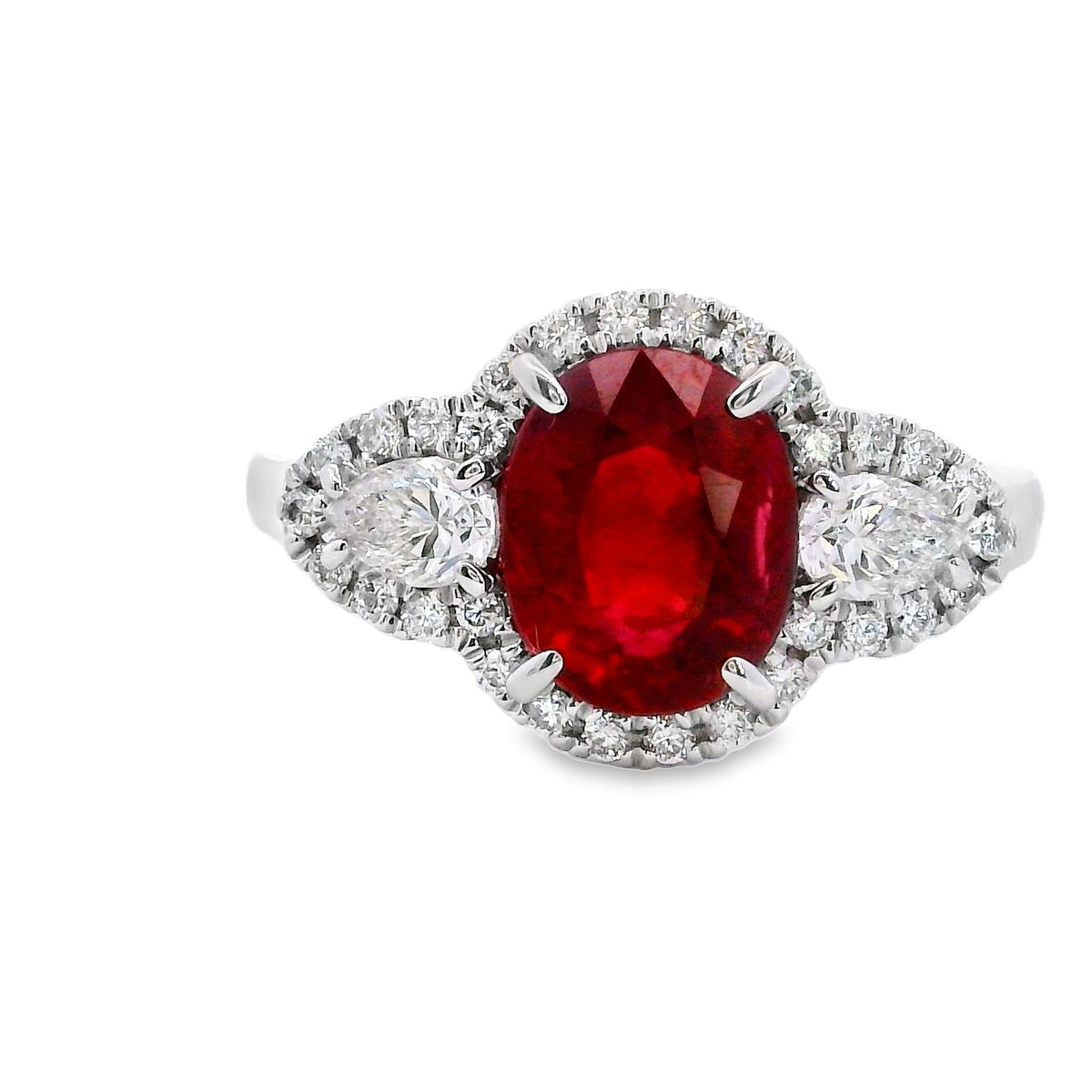 18Kt White Gold 3-Stone Ring with 2.24Ct Oval Ruby (8.5x7mm), 2.36cttw Natural Pear Shaped Diamonds and 30.22cttw Round Diamonds (Color G-H, Clarity SI1)