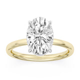 14K yellow gold engagement ring featuring an oval-cut diamond solitaire in a four-prong white gold setting.