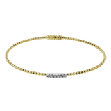 White gold diamond tennis bracelet with alternating diamond links.