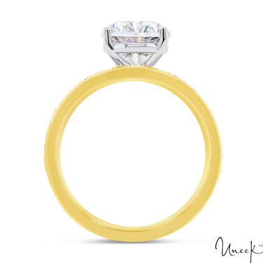 Yellow gold engagement ring with oval-cut diamond solitaire in a classic four-prong setting.