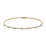 White gold diamond tennis bracelet with alternating round diamond links.