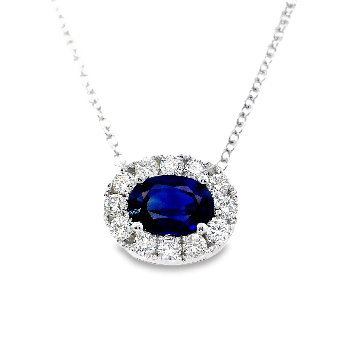 Center of My World 14Kt White Gold Halo Pendant with 1.18Ct Oval Sapphire and .35cttw Natural Diamonds