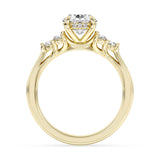 Yellow gold engagement ring with oval-cut center diamond and hidden halo detail.