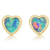 Heart-shaped opal stud earrings with pink and blue iridescence in yellow gold settings.