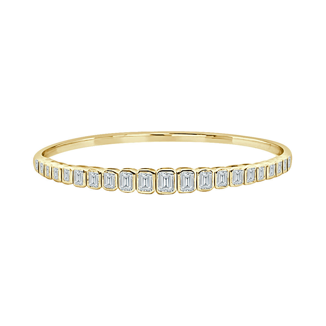 14Kt Yellow Gold Flexible Bangle Bracelet with Graduated Natural Bezel Set Emerald Cut Diamonds