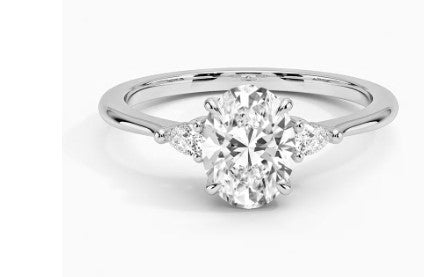 18Kt White Gold 3-Stone Ring With .70ct Oval Center Natural Diamond