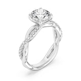 White gold engagement ring with round center diamond and pavé diamond split shank band.