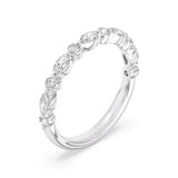 White gold diamond eternity band featuring continuous round brilliant-cut diamonds.
