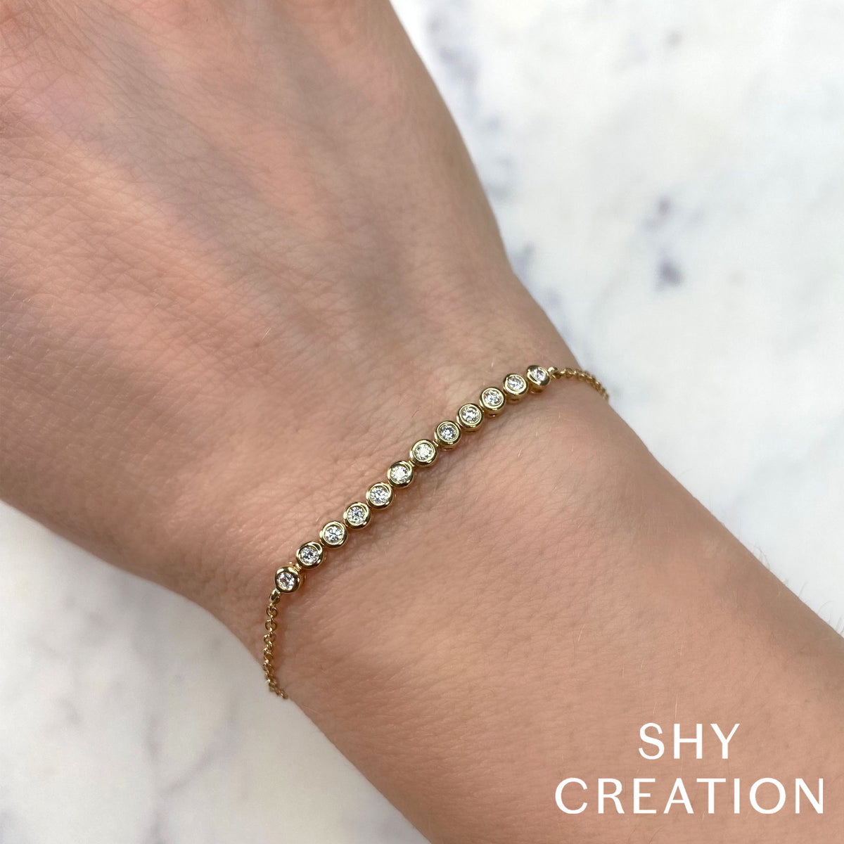 Shy Creation 14Kt White Gold Bracelet with Natural Bezel Set Diamonds