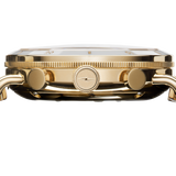 Gold-tone luxury wristwatch with diamond bezel and rectangular link bracelet, profile view.