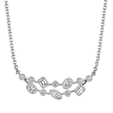 White gold diamond necklace featuring clustered round diamond stations along a delicate chain.