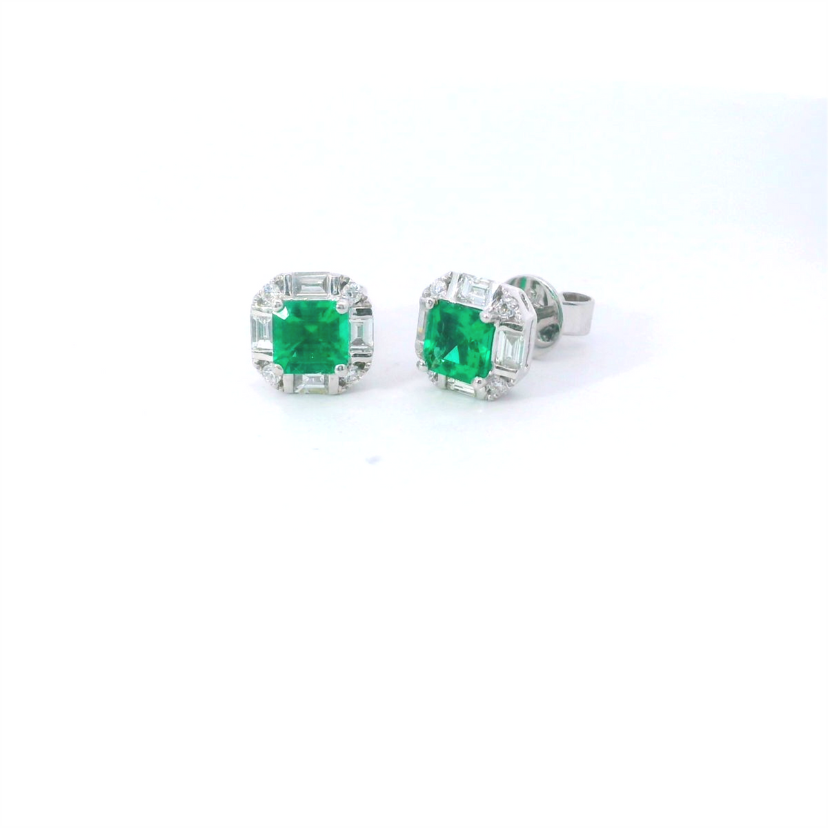 18Kt White Gold Halo Stud Earrings with 2.84cttw Natural Emeralds and .38cttw Natural Baguette and Round Diamonds (Color G-H, Clarity SI1)