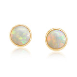 Round gold stud earrings with brushed finish and minimalist design.