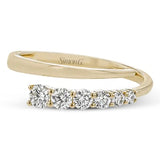 Yellow gold diamond anniversary band featuring channel-set round diamonds.